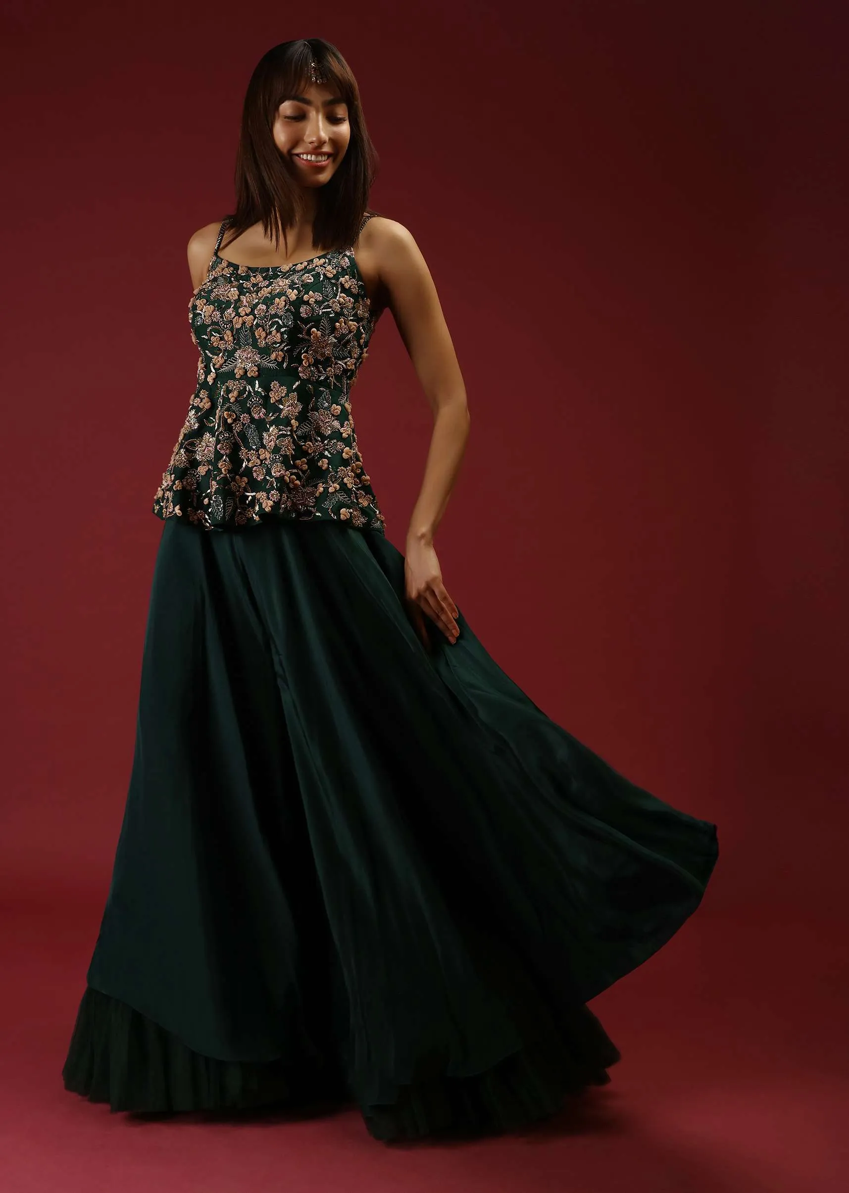 Bottle Green Palazzo Pants With A Heavy Hand Embroidered Peplum Top Adorned In Multicolored Beads And 3D Flowers