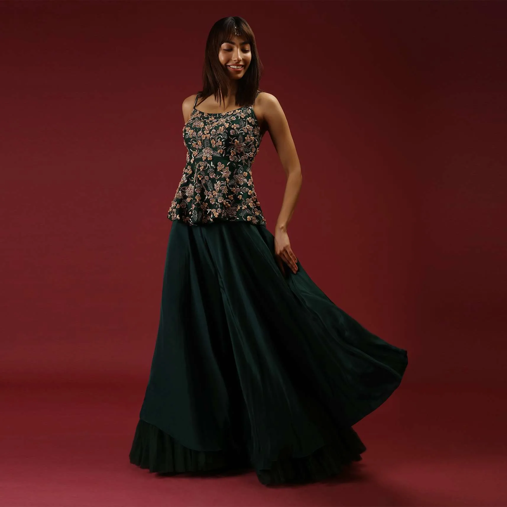 Bottle Green Palazzo Pants With A Heavy Hand Embroidered Peplum Top Adorned In Multicolored Beads And 3D Flowers